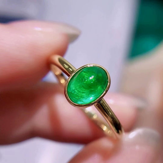 18 karat gold 1.1ct vivid green natural emerald ring